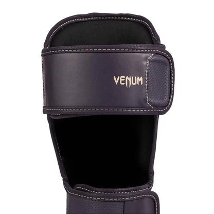 Venum Impact Evo Shin Guards - Deep Purple, Multi-Density Foam, Reinforcement at Tibia & Instep, Two Wide Adjustable Straps, Beige Logo Design